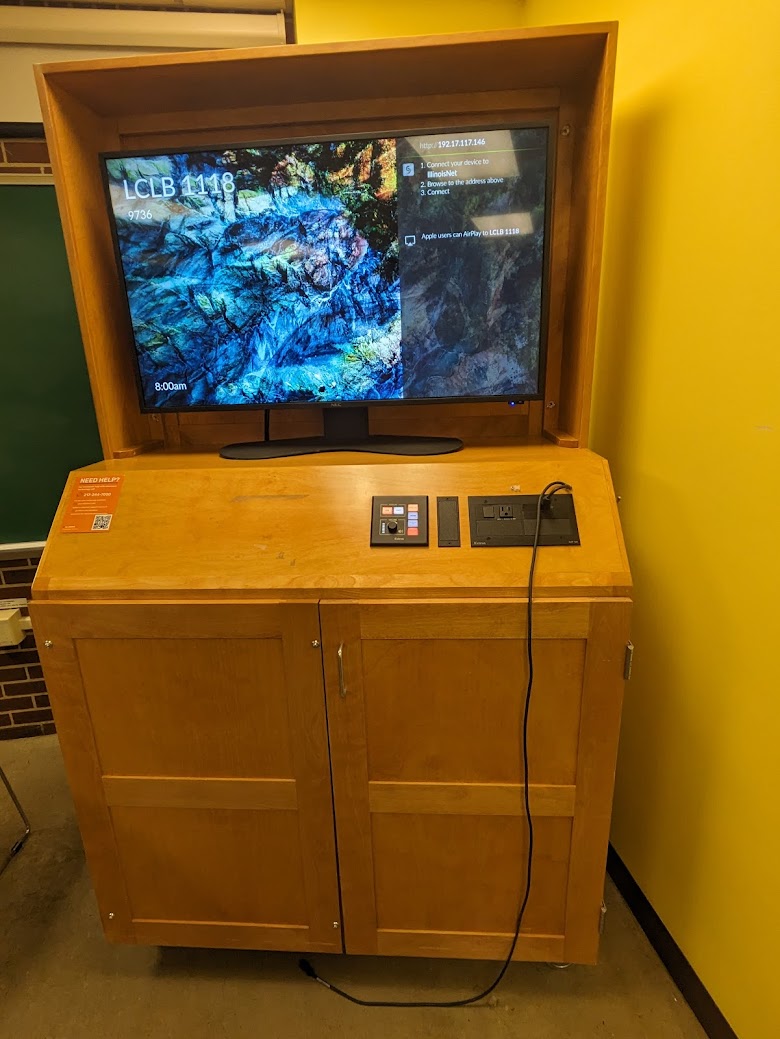A view of the cabinet with a high definition LCD monitor, wireless input, and a push button controller.
