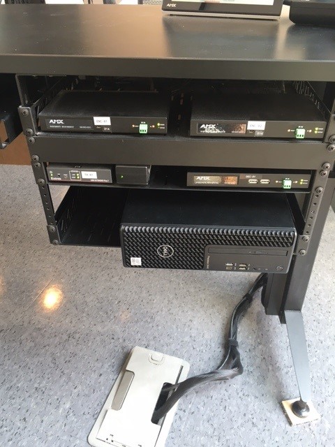 This inside of the cabinet with the control panel, keyboard, mouse on top of the lectern, with the PC and sound equipment inside the cabinet.