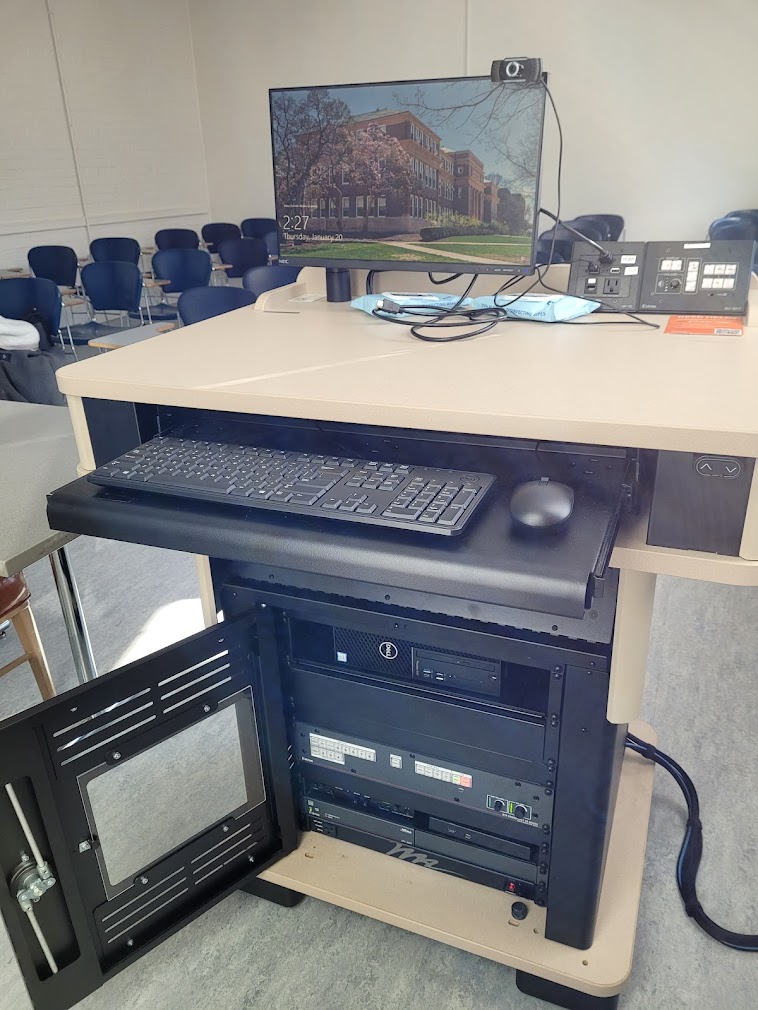 A view of the open cabinet with PC, keyboard, HDMI input, push button controller, and audio visual rack.