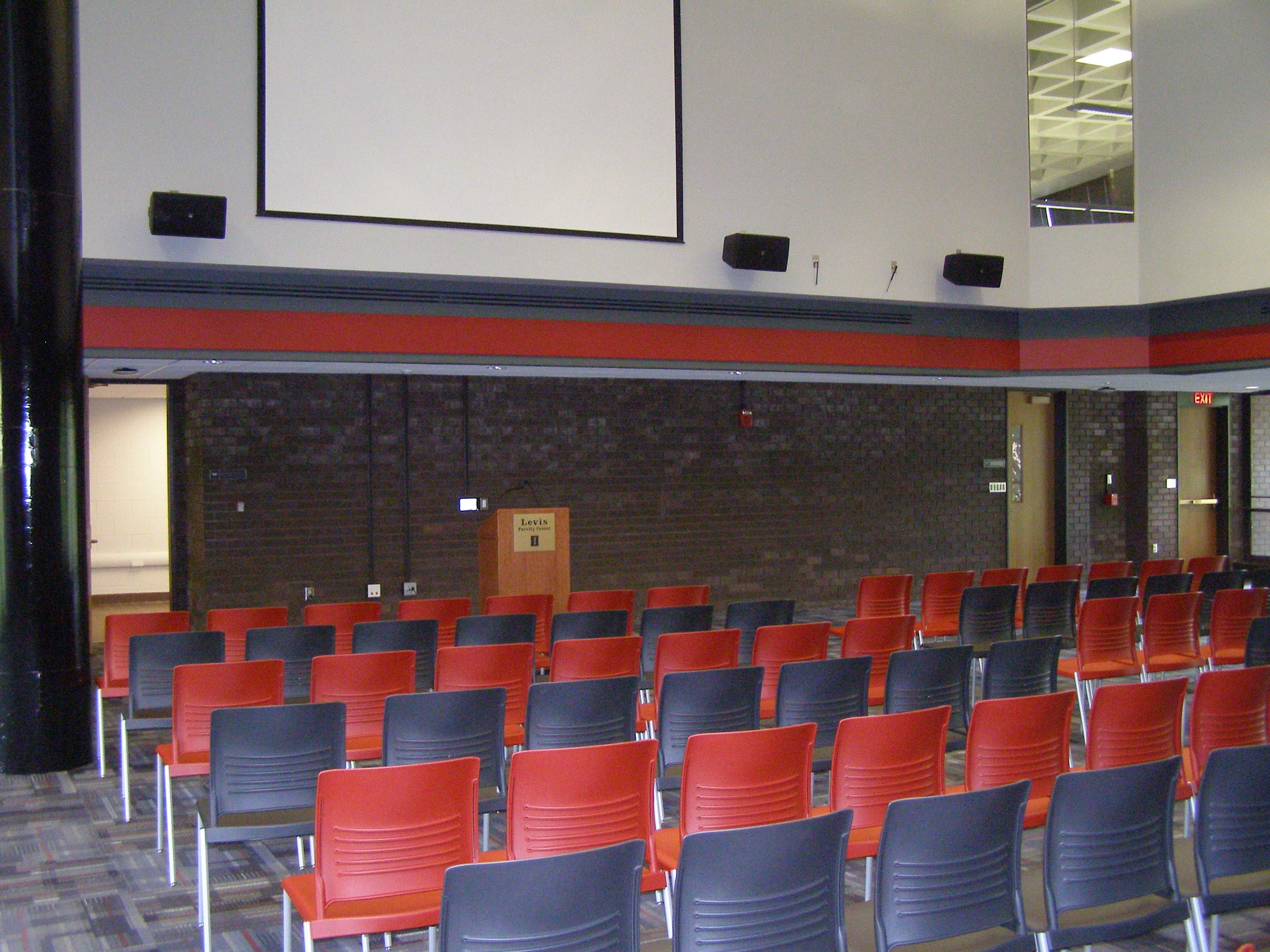 This is a vew of the room, with moveable chairs, and lectern in front.