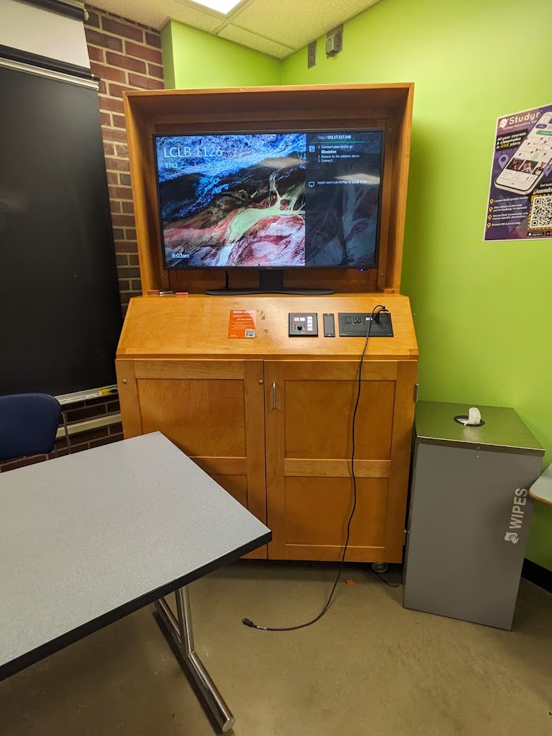 A view of the cabinet with a high definition LCD monitor, wireless input, and a push button controller.